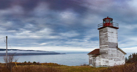 Panorama of a Canadian wooden lightouse in Cape Breton