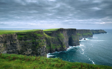 Spectacular view of dramatic Cliffs of Moher and wild Atlantic Ocean, County Clare, Ireland.