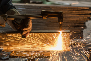 Worker metal Cutting With acetylene welding cutting torch