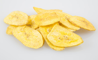 Green banana fried on a neutral background