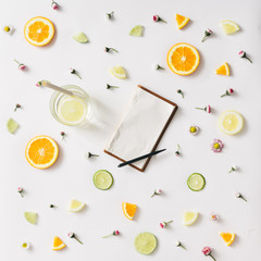 Colorful pattern made of citrus fruits and flowers. Flat lay
