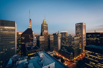 Fototapeta na wymiar View of buildings in downtown at night, in Baltimore, Maryland.