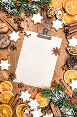 Obraz na płótnie Canvas Christmas cookies spices. Holidays food. Paper recipe text