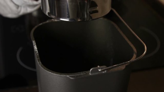 Woman is sieving flour