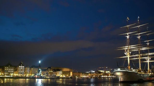 The Ship Af Chapman in Stockholm at night. The old town in the background.