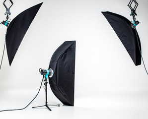 Empty photo studio with lighting equipment