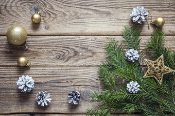 Christmas background with fir branches and decorations on old wo