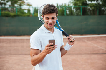 Tennis player with phone © Drobot Dean
