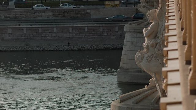 Margit Bridge and Danube River in central Budapest, Hungary. Historical sculpure.