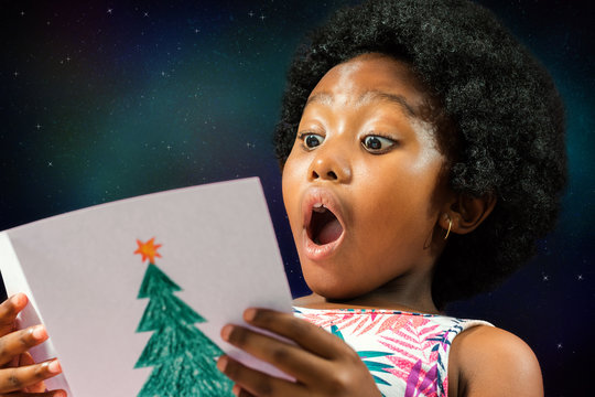 African Girl Reading Christmas Card.