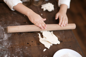 Making homemade christmas cookies in various shapes