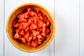 Chopped Tomatoes In Wood Bowl