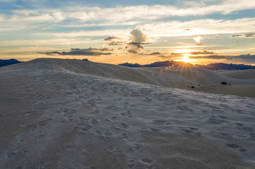 Great Sand Dunes in Colorado with footprints trail path during sunset