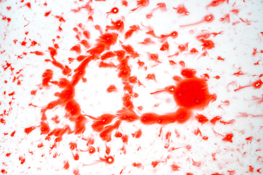 Blood drips on white surface
