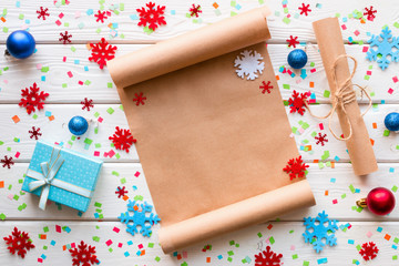 Christmas list of wishes and gifts on the background of snowflakes and confetti
