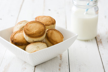 Christmas shortbread with milk on white wooden background

