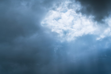 light through clouds - rain producing clouds
Light beams penetrate through cloud from sky.