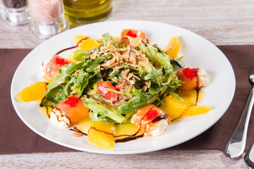 salad with red fish and orange