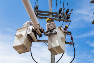electrician repair the transmission system.