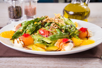 salad with red fish and orange