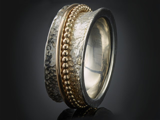 beautiful silver ring isolated on black background