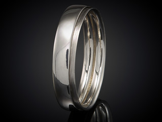 beautiful silver ring isolated on black background