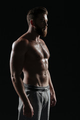 Fototapeta na wymiar Side view of naked athletic man