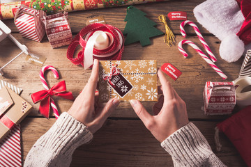 Fototapeta premium Preparing a Christmas gift for friends.