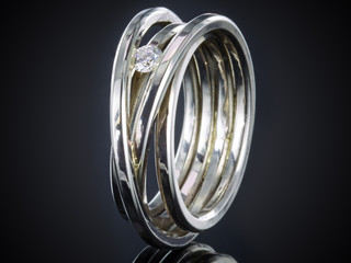 silver ring with gemstone isolated on black background