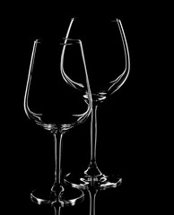 Glasses of red wine on a black background, Bohemian crystal, bur