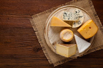 Fototapeta na wymiar Mix cheese on wooden board.