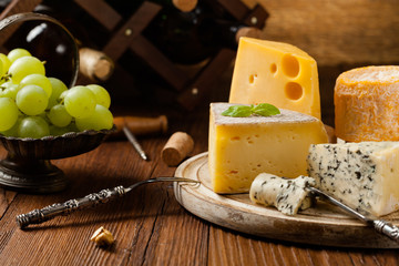 Mix cheese on wooden board.