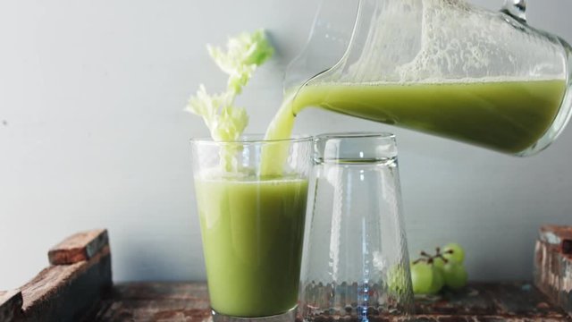 Grapes and Celery Smoothie being poured. Overflow
