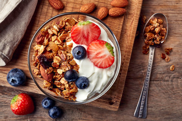 Homemade granola with yogurt and fresh berries - obrazy, fototapety, plakaty