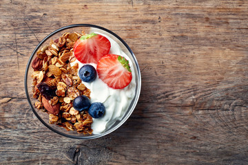 Homemade granola with yogurt and fresh berries