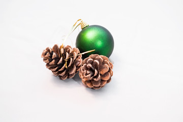 Christmas pinecone fir Christmas ball green background