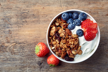 Homemade granola with yogurt and fresh berries - obrazy, fototapety, plakaty