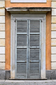 Old door with blue shutters