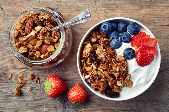 Homemade granola with yogurt and fresh berries