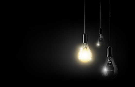 Glowing light bulb is hanging between a lot of turned off light bulbs on dark black background, copyspace, transparent vector
