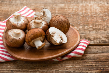 Mushrooms on a rustic wooden table. Copyspace.