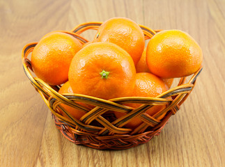 Ripe tangerines in the wicker basket
