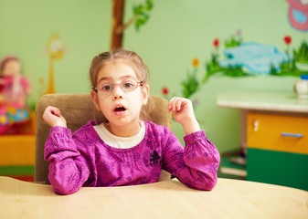 cute little girl in kindergarten for kids with special needs