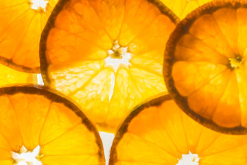 Soft focus,Abstract background with silhouette citrus-fruit of orange slices. Close-up. Studio photography.