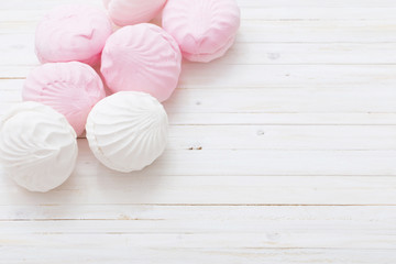 marshmallow - zephyr on a light wooden table