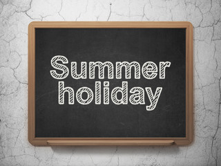 Tourism concept: Summer Holiday on chalkboard background