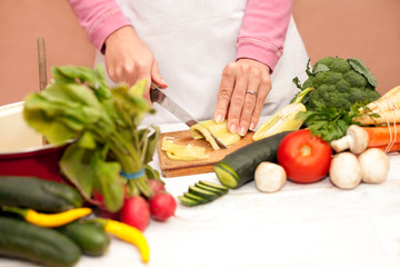 Woman slicing fresh bell pepper