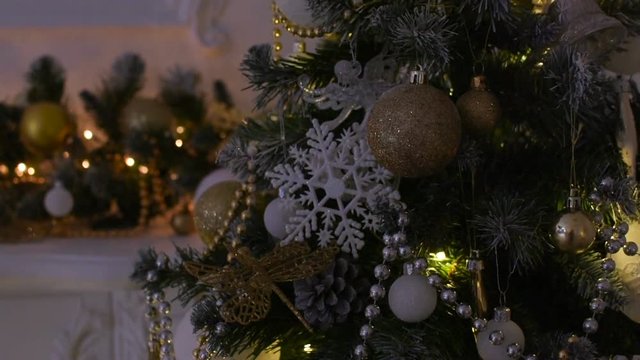 Beautiful toys on a Christmas tree. Camera movement from the bottom up.