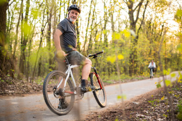 Fototapeta premium Senior man on his mountain bike outdoors 