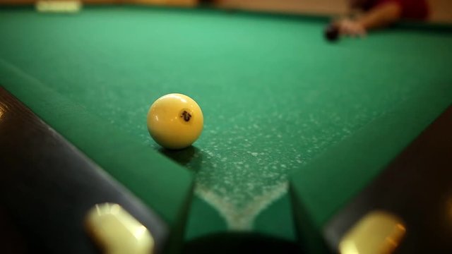 billiard balls on green baize in the game of pyramid